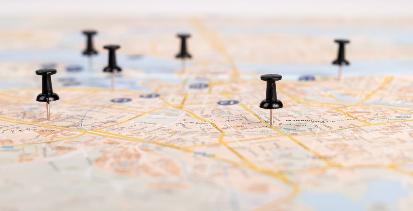 Push pins on paper map. Road travel concept, planning itinerary